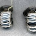 Spacer paks for fine tuning main spring pre-tension