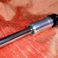 Waisted aluminium hammer with oil filled nylon core on polished barrel
